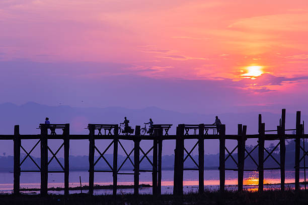 U bein bridge Way of life at U-bein bridge in the morning. Location of Mandalay, Myanmar. u bein bridge stock pictures, royalty-free photos & images