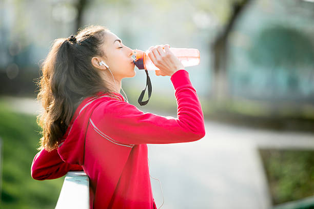 istock Runner woman drinking after exercises 531914420