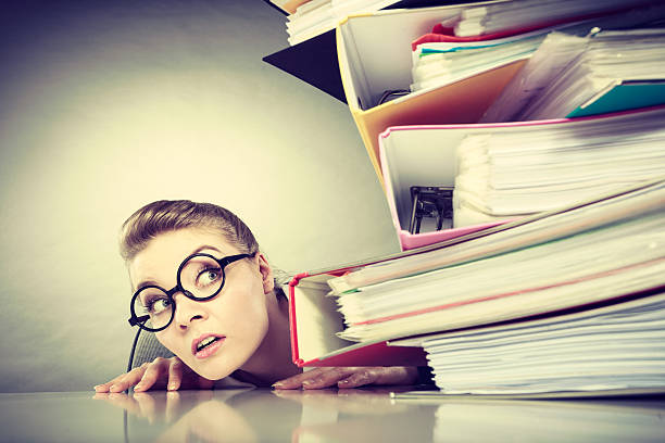 istock Accountant terrified of pils of binders. 531914682