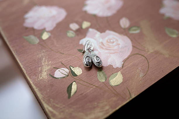 istock Earrings on painted with watercolor wood surface 531916150