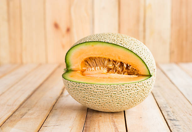istock Fresh melons on wooden table 531916338