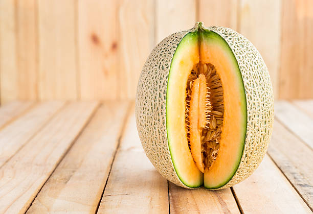 istock Fresh melons on wooden table 531916358