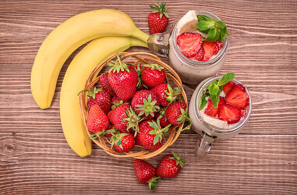 Smoothies with oatmeal ,strawberry, banana in glass . stock photo