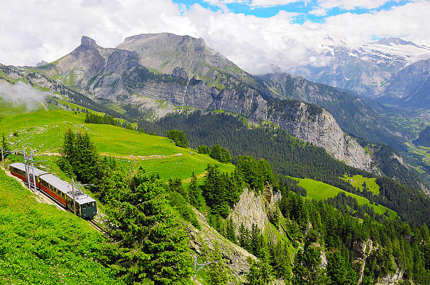 Retro passenger train moves from Schynige Platte to Interlaken. Switzerland.