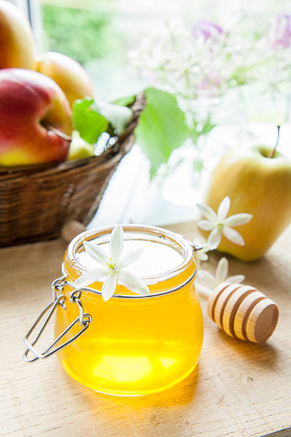 istock Apple and honey on light wooden table 531920964