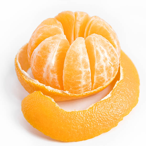 Ripe sweet tangerine with peeled skin stock photo