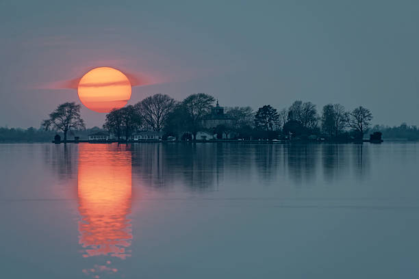Majestic Sunset over Island in Lake. 