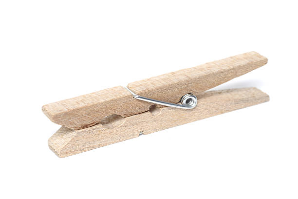 istock Wooden clothes peg isolated on a white background. 531925211