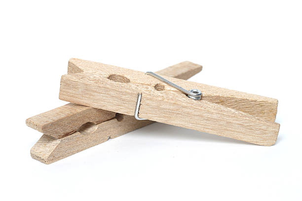 istock Wooden clothes peg isolated on a white background. 531925213