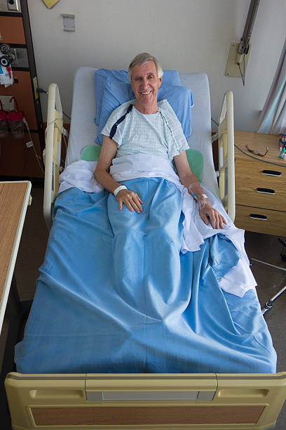 istock Mature Man Smiles From His Hospital Bed 531925637