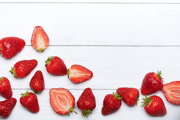 istock strawberry fruits on wooden background 531925654