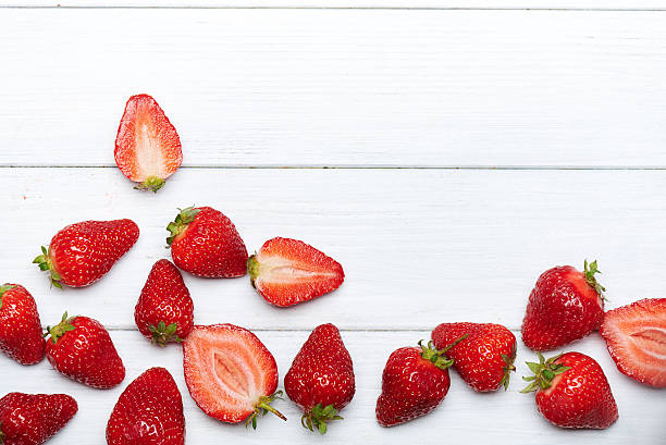 istock strawberry fruits on wooden background 531925702