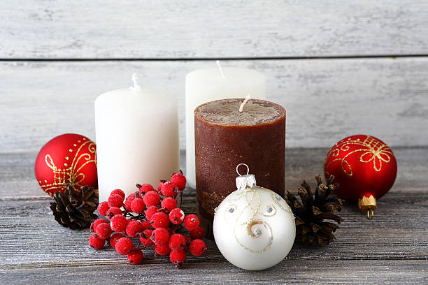 istock Christmas balls with candles on the boards 531925873