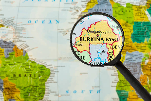 карта буркина-фасо - focus globe magnifying glass glass стоковые фото и изображения