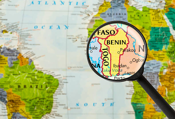 Map of Republic of Benin Map of Republic of Benin through magnifying glass benin stock pictures, royalty-free photos & images