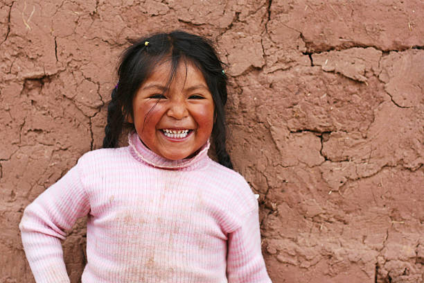 little girl laughing little peruvian girl laughing poverty child ethnic indigenous culture stock pictures, royalty-free photos & images