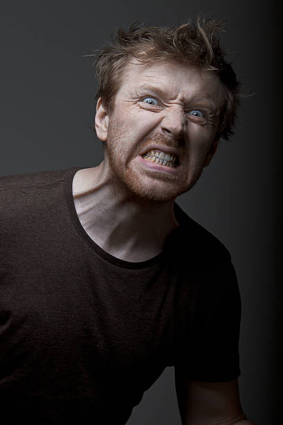istock Man in a dark brown t-shirt crazy 531926686