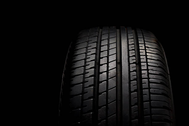 istock Car tires close-up on black background 531927101