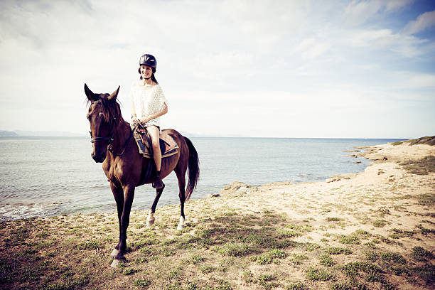 young woman horseback riding