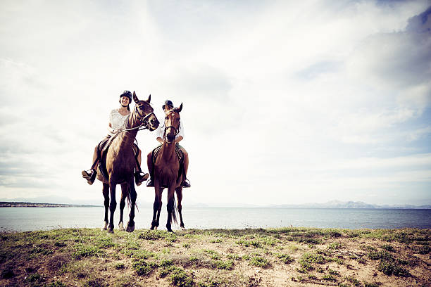 istock young tourist couple horseback riding 531927135