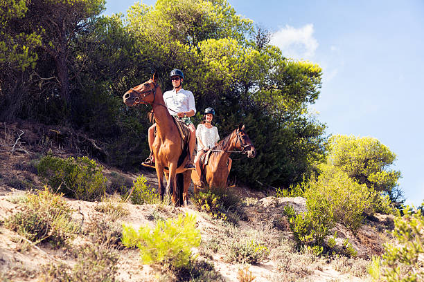 istock young tourist couple horseback riding 531927159
