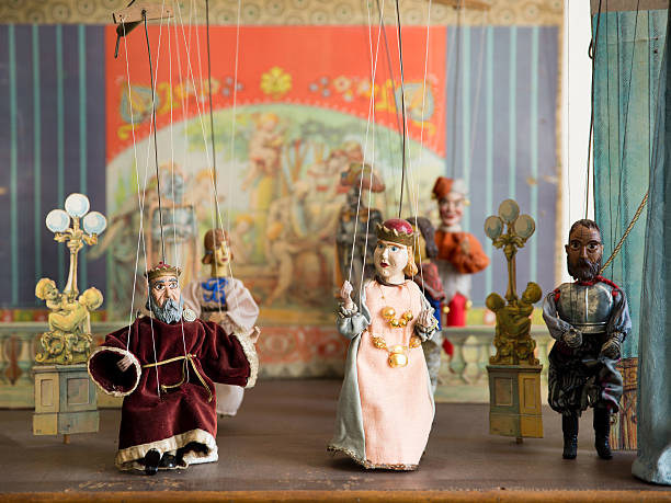 old marionettes - puppeteer stock-fotos und bilder