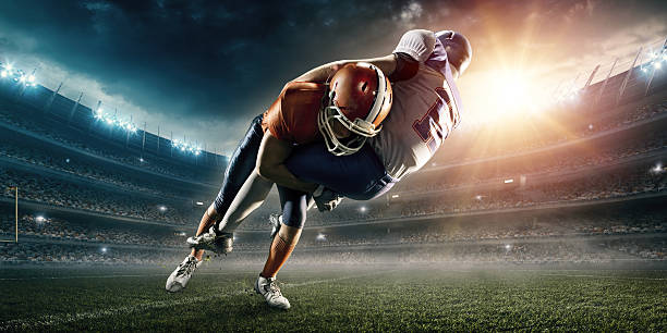 istock American football player being tackled 531928024