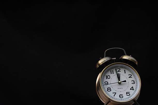 istock Classic Alarm Clock isolated on black 531928172