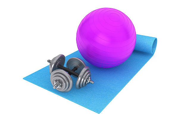 istock Fitness ball and dumbbells over mat 531928903