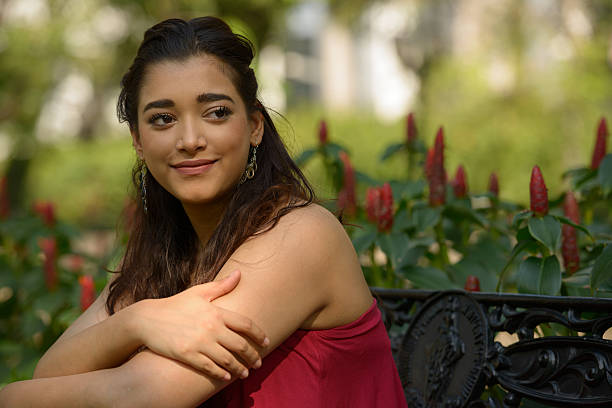 istock Indian woman sitting on park bench 531929204