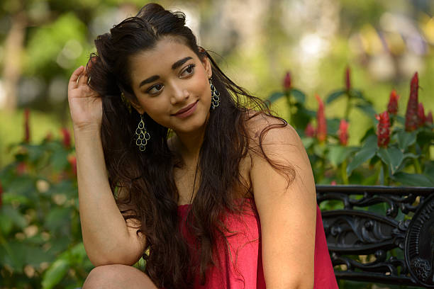 istock Indian woman sitting on park bench 531929884