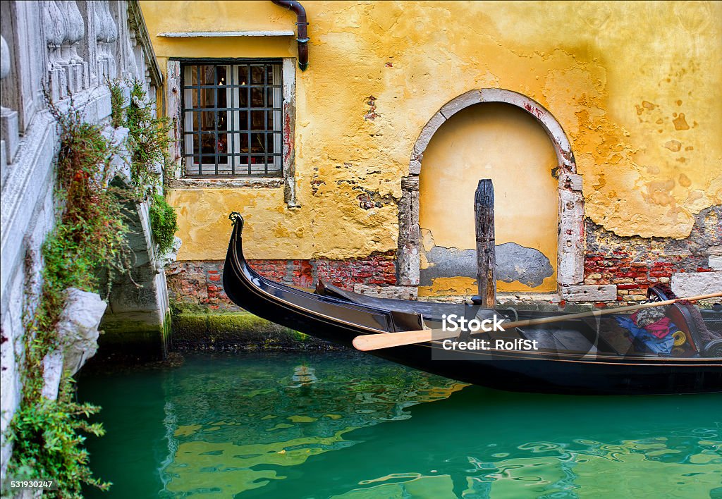 Venice Gondola moored in a canal in Venice Venice - Italy Stock Photo