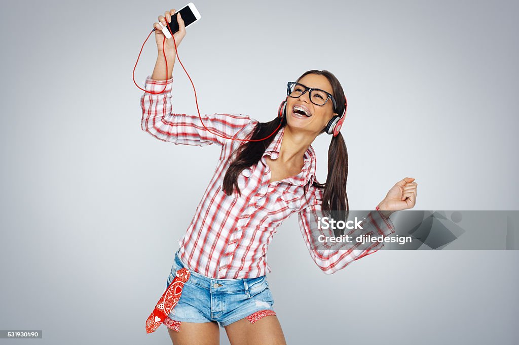 Beautiful Geek Girl With Braces Enjoy The Music Stock Photo - Download  Image Now - Adult, Adults Only, Arts Culture and Entertainment - iStock