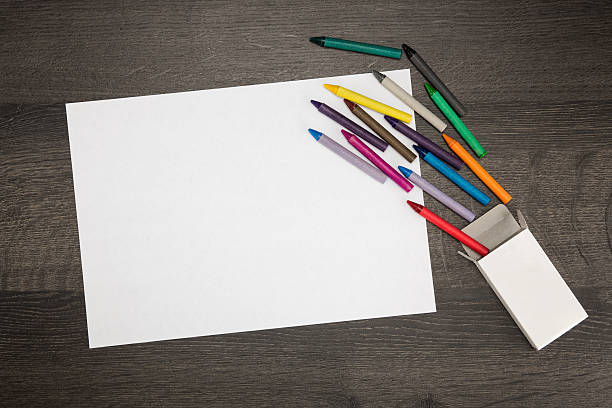 istock White paper with colorful crayons. 531930645