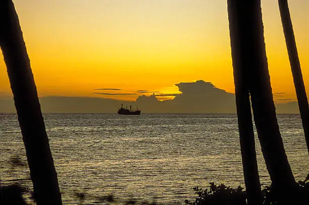 Ship on the horizon seen from the island of Biak, Indonesia.