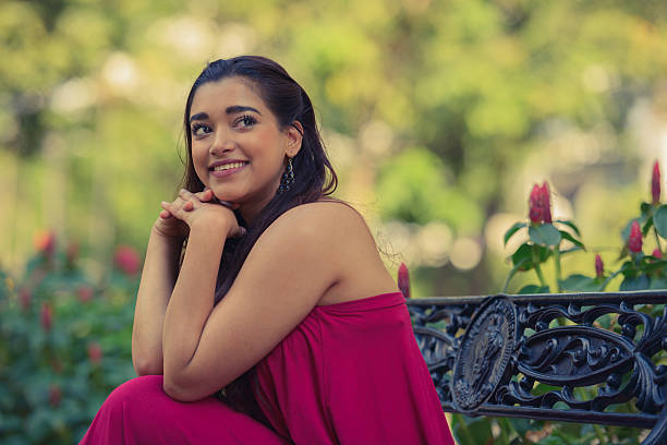 istock Indian woman sitting on park bench 531933348