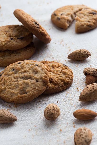 istock Cookies pile with chocolate chip and almond on light textile 531933594