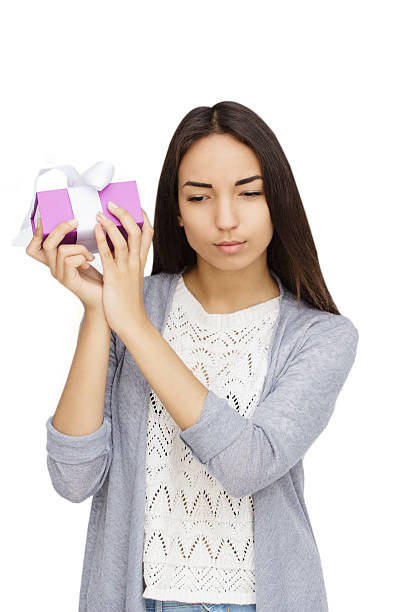 istock Young woman portrait holding gift 531935772