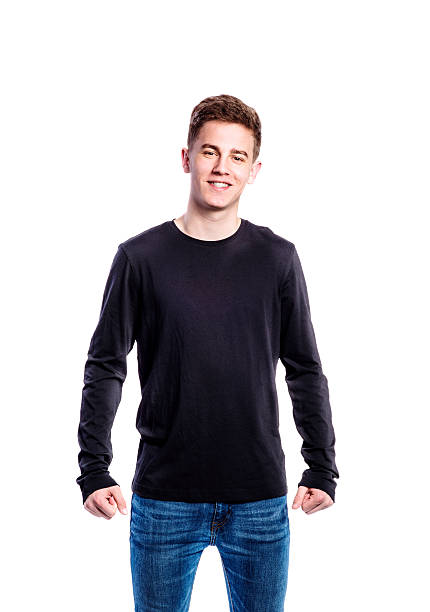 Boy in jeans and t-shirt, young man, studio shot