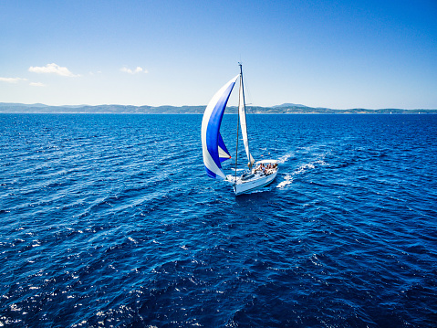 Panoramic view of wooden ship's wheel on the boat at the ocean