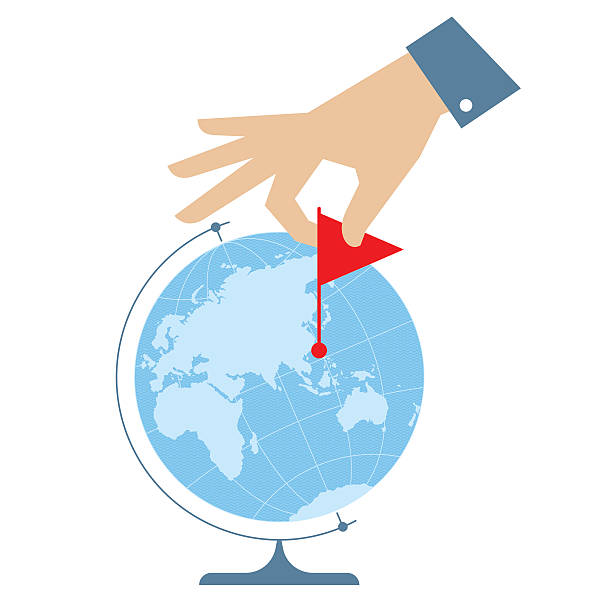 Flat vector illustration of eastern globe and human hand People travel concept. Flat vector illustration of eastern globe hemisphere and human hand with flag marker. Man is pointing a place on the map. Infographic element for web, print, social networks. finger spinning globe stock illustrations