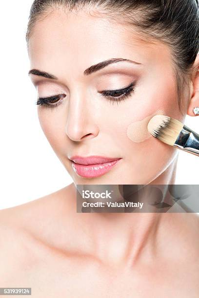 Makeup Artist Applying Liquid Tonal Foundation On The Face Stock Photo - Download Image Now