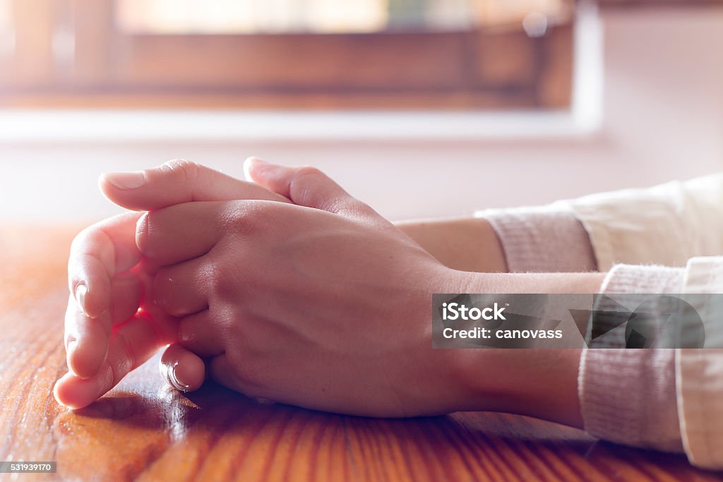 Close-up of woman hands in reflexive and concern position Concepts of impatience, worry, waiting for and others Anxiety Stock Photo