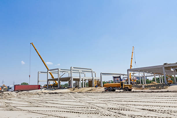 istock Mobile crane is operating and lifting concrete joist. Landscape 531939188