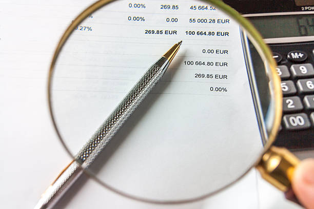 istock Magnifying Glass,Pen And Calculator on Financial Document 531939412