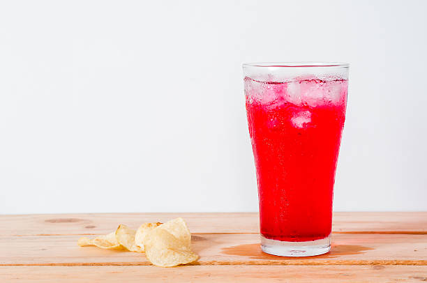 red drinks with soda in glass and fired potato