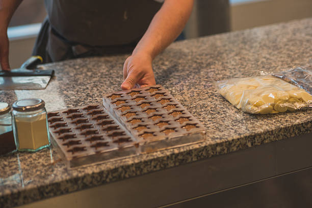 istock hands of worker by chocolate production 531941014