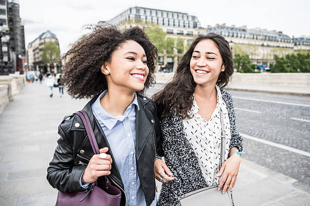 istock Two young women smiling and talking in Paris 531941146