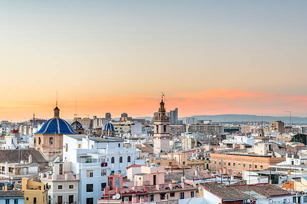 Panoramic view of the roofs of Valencia Panoramic view of the roofs of the ancient city of Valencia at sunset, Spain. The belfry of the Cathedral. dome tent photos stock pictures, royalty-free photos & images