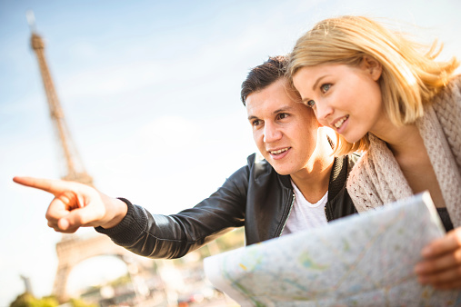 couple of tourist on Paris reading a map
